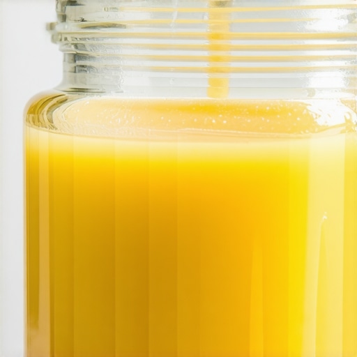 Close-up of grass-fed beef tallow in a jar highlighting its rich texture and natural color.