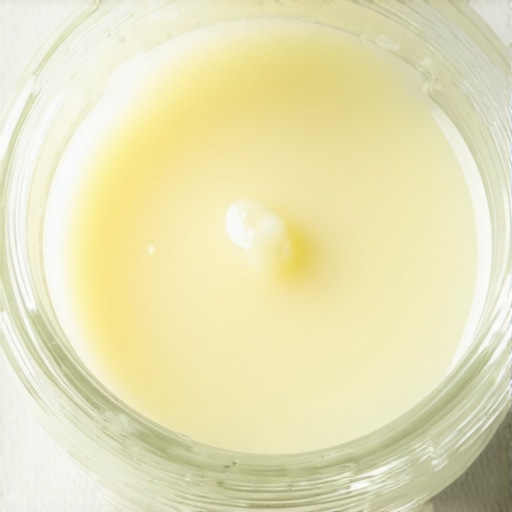 Close-up view of organic grass-fed beef tallow in a glass jar, highlighting its rich texture and natural appearance